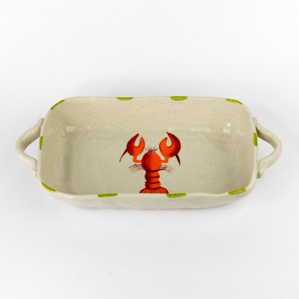 Rectangular ceramic dish with a red lobster design on a beige background