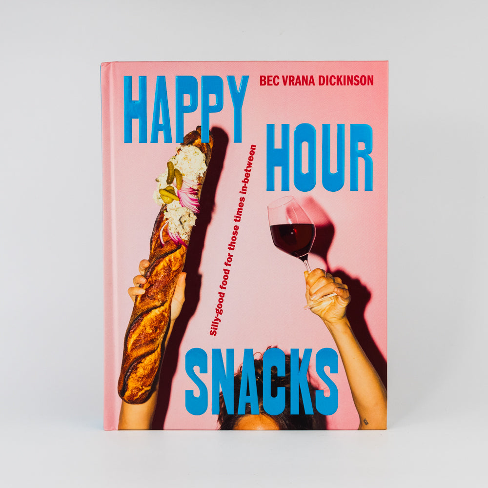 Book cover of 'Happy Hour Snacks' with a pink background, bread, and wine glass.