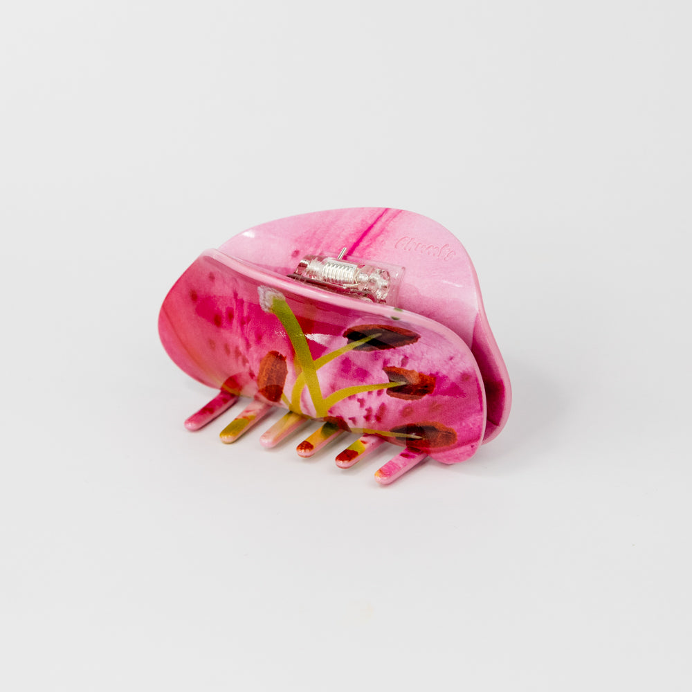 Hair claw with a photo-realistic pin lily design on a white background
