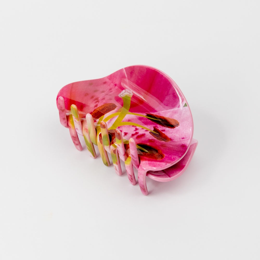 Hair claw with a photo-realistic pin lily design on a white background