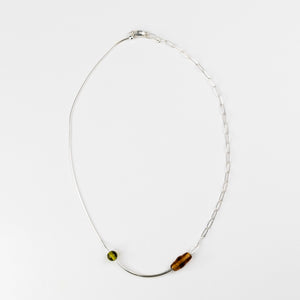 Necklace with two beads on a white background