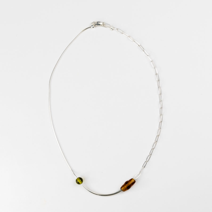 Necklace with two beads on a white background