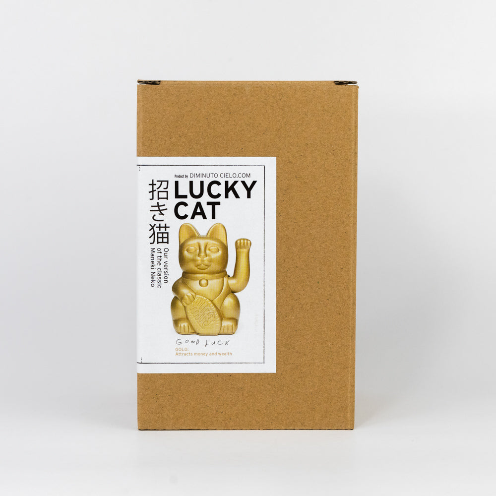 Gold waving cat figurine on a white background