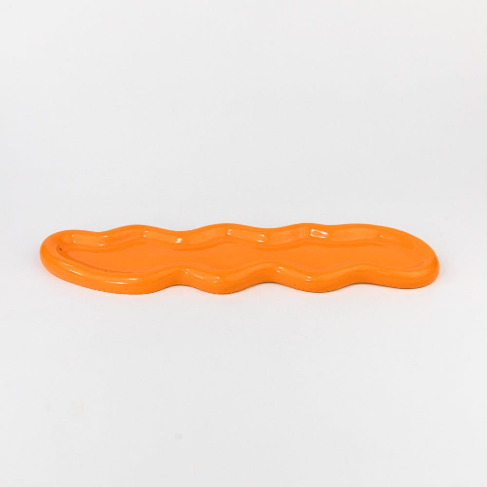 Orange wavy object on a white background