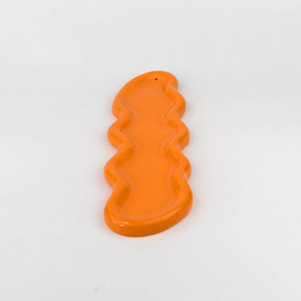 Orange wavy-shaped object on a white background