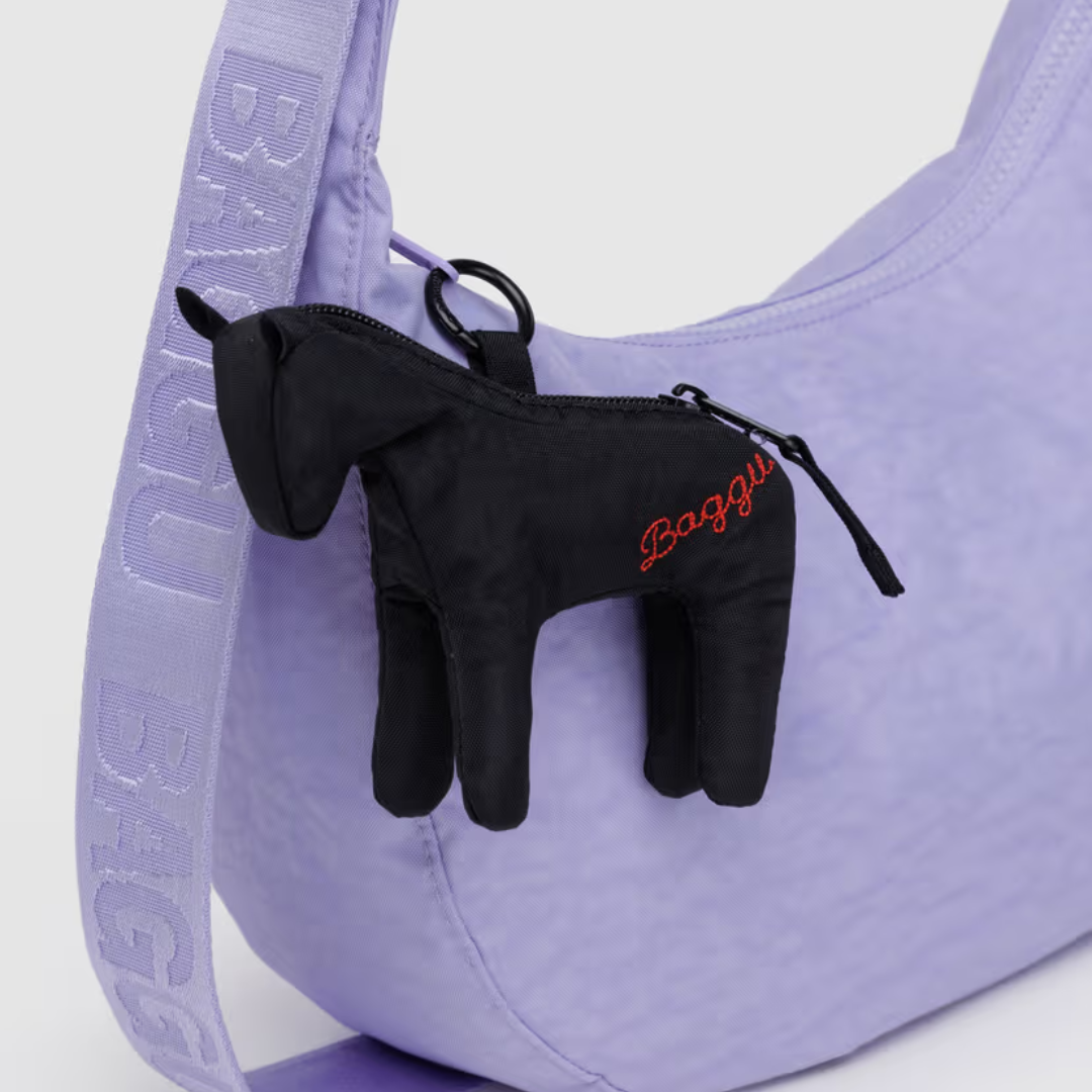 Black horse-shaped bag charm with 'Baggu' branding on a light gray background