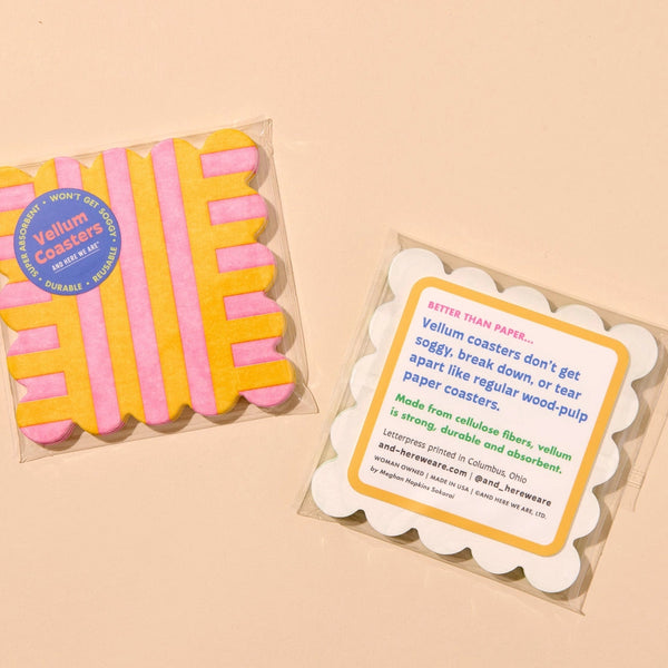 Vellum paper coasters with packaging on a beige background