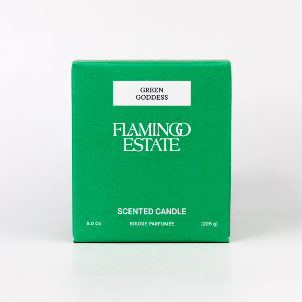 Green box of Flamingo Estate Green Goddess scented candle on a white background