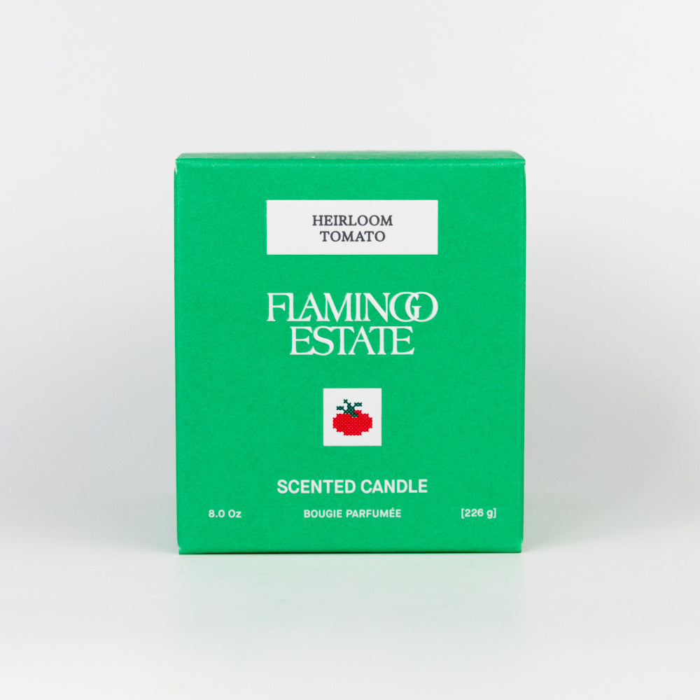 Green box of Flamingo Estate Heirloom Tomato scented candle on a white background