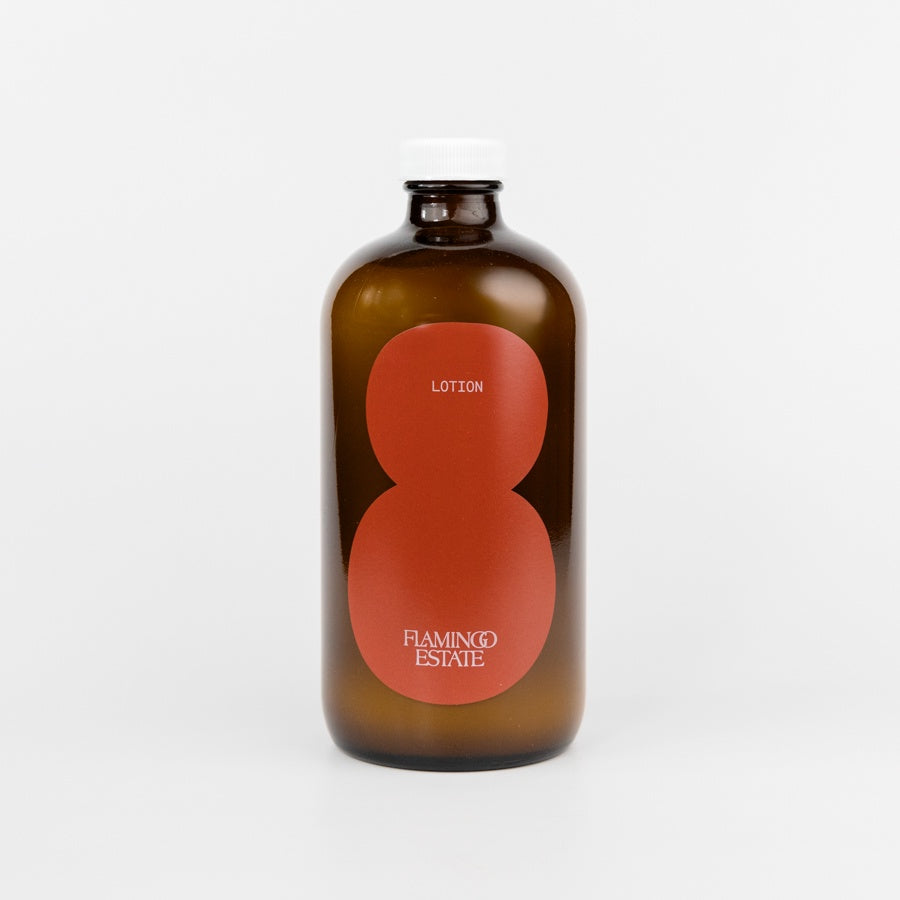 Brown bottle with a red label on a white background