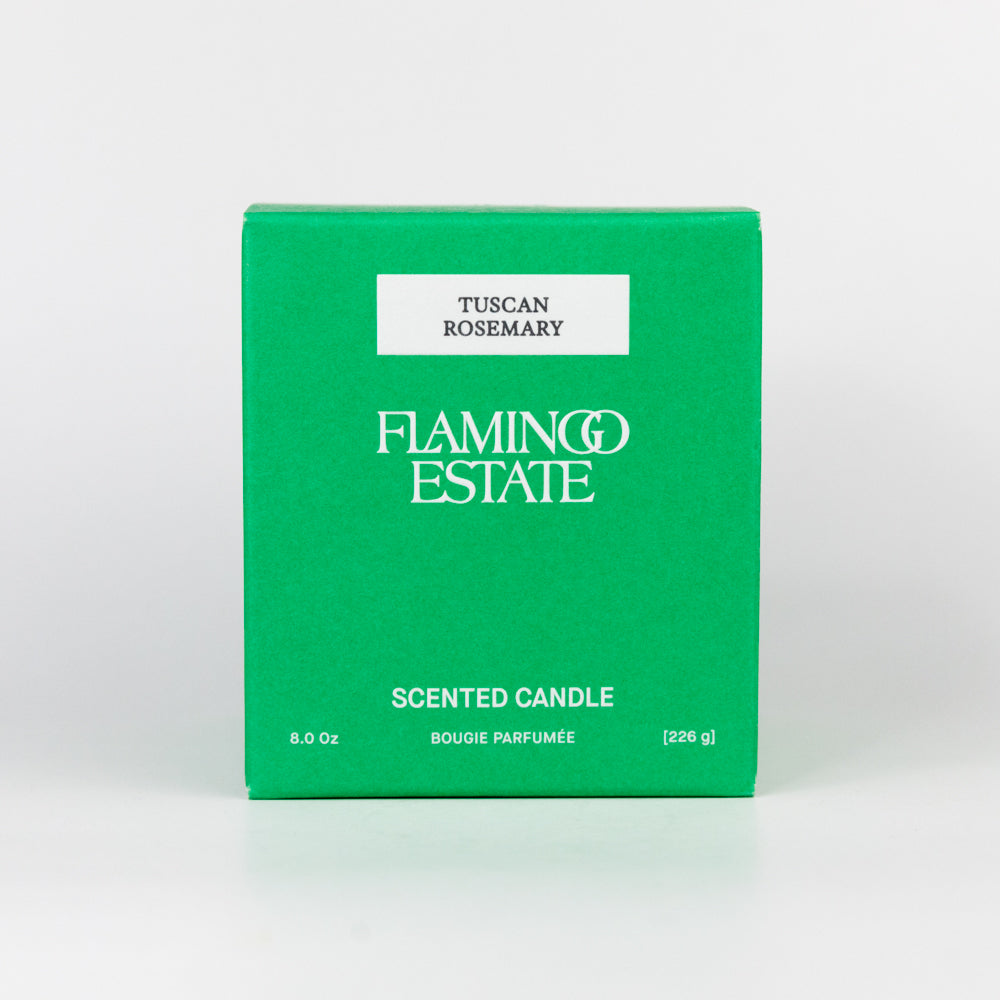 Green box of Flamingo Estate Tuscan Rosemary scented candle on a white background