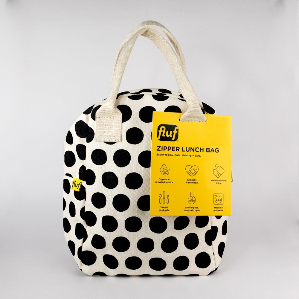 Polka dot lunch bag with yellow Fluf label on a light gray background