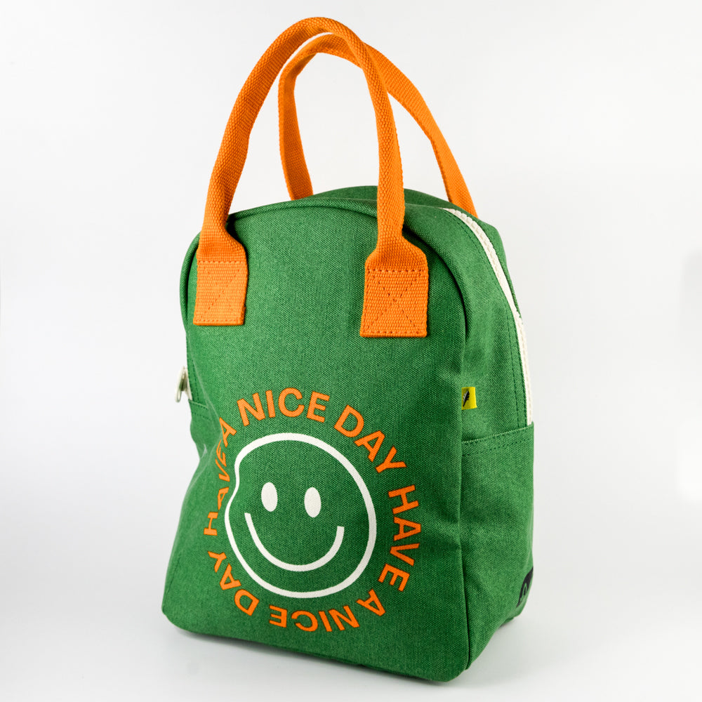 Green zipper lunch bag with orange handles and a yellow tag on a white background