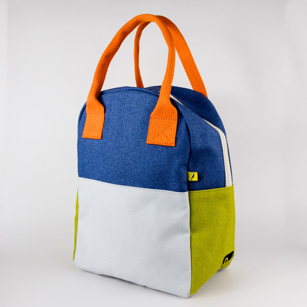 Colorful lunch bag with orange handles and a yellow tag on a white background