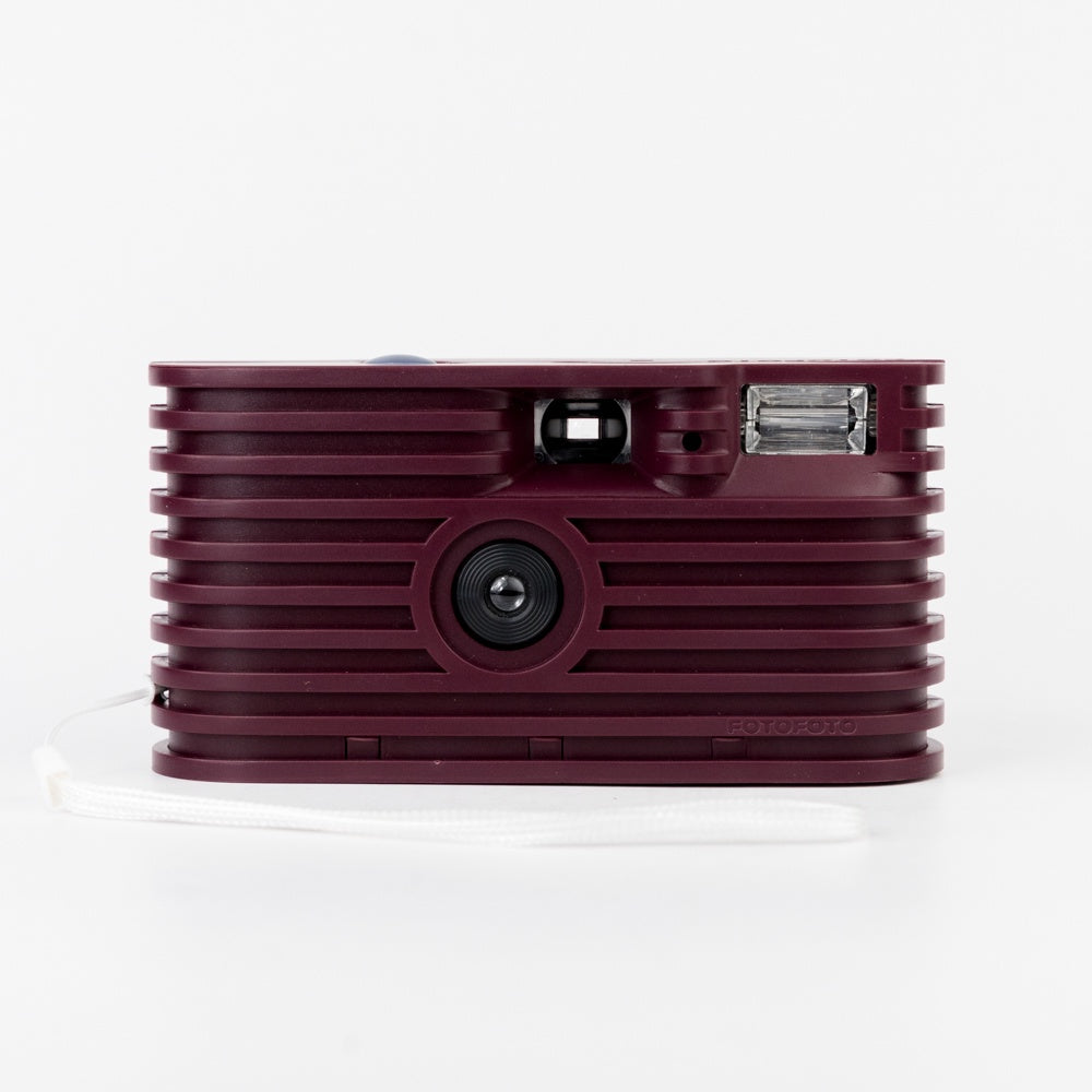 Maroon textured camera on a white background