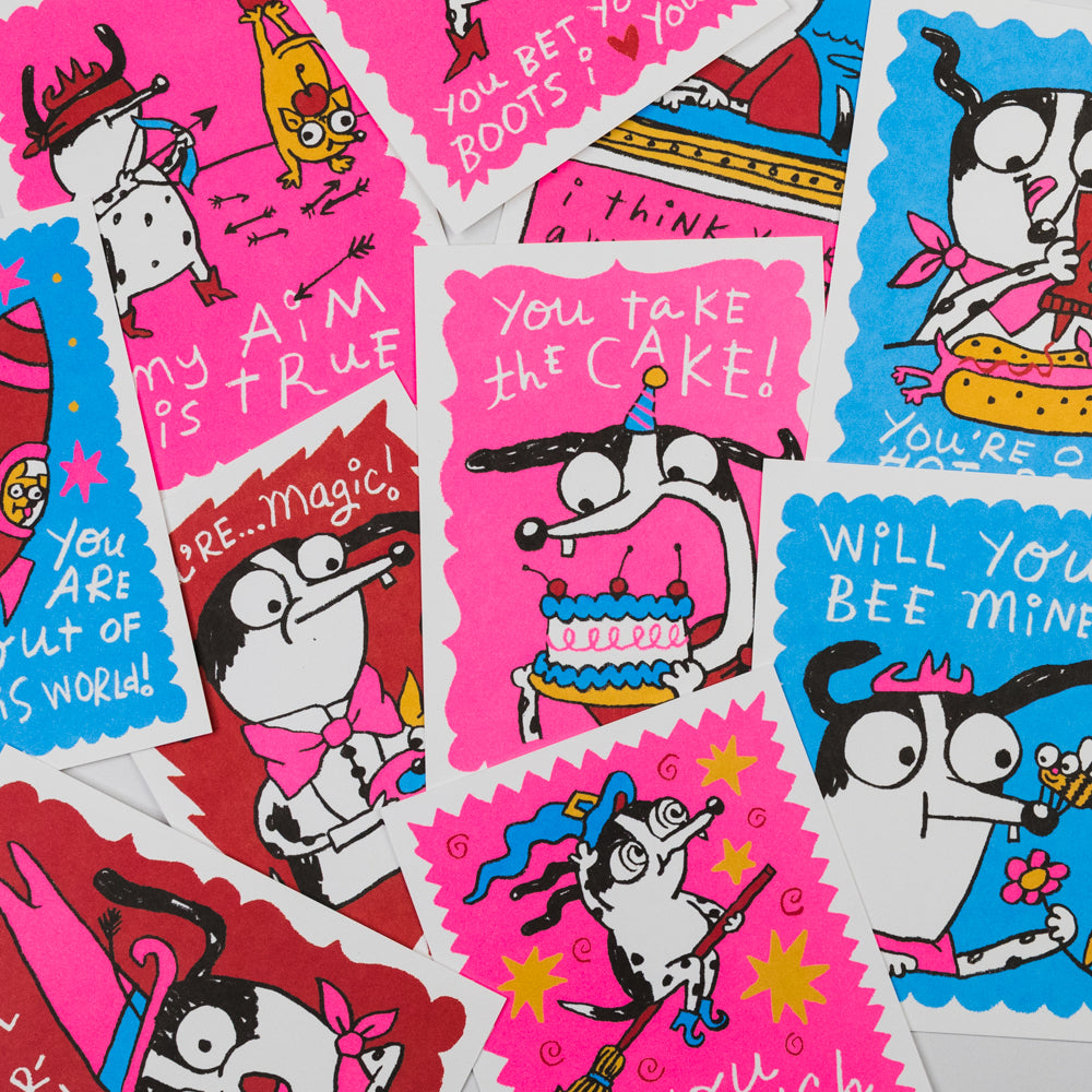 Pink box of 'Cowgirl Valentines' with a cartoon cow design on a gray background