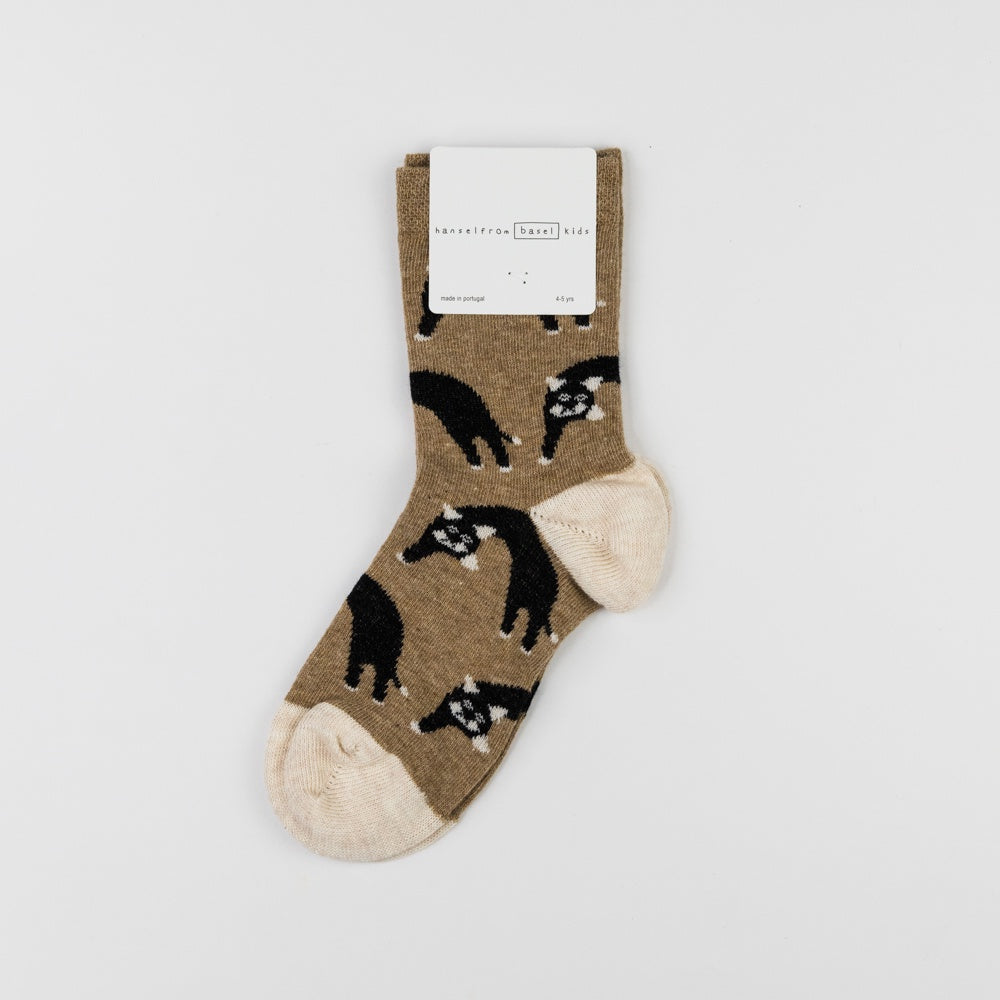 Sock with black animal pattern on a beige background