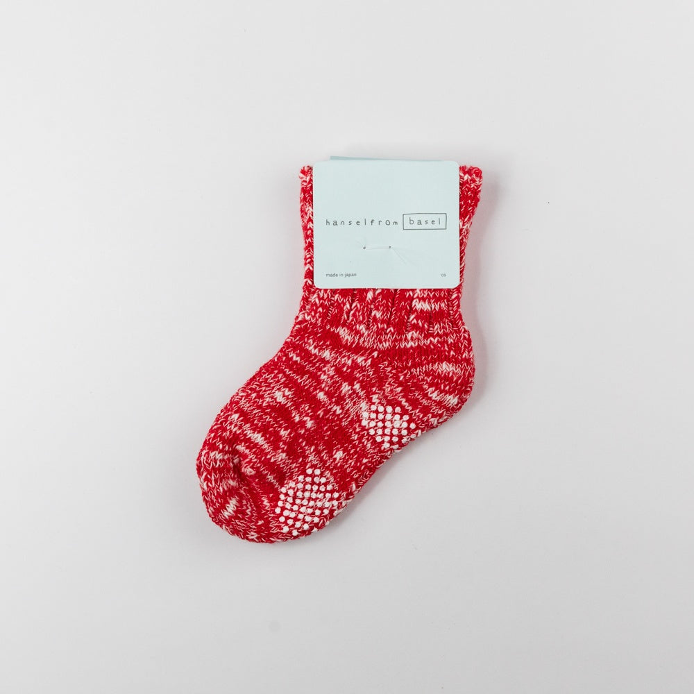 Red patterned sock on a light gray background