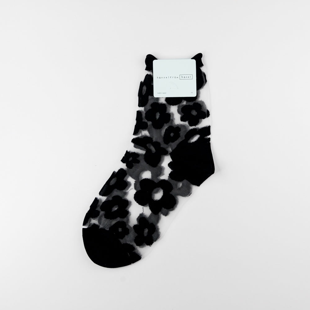 Black floral-patterned sock on a white background