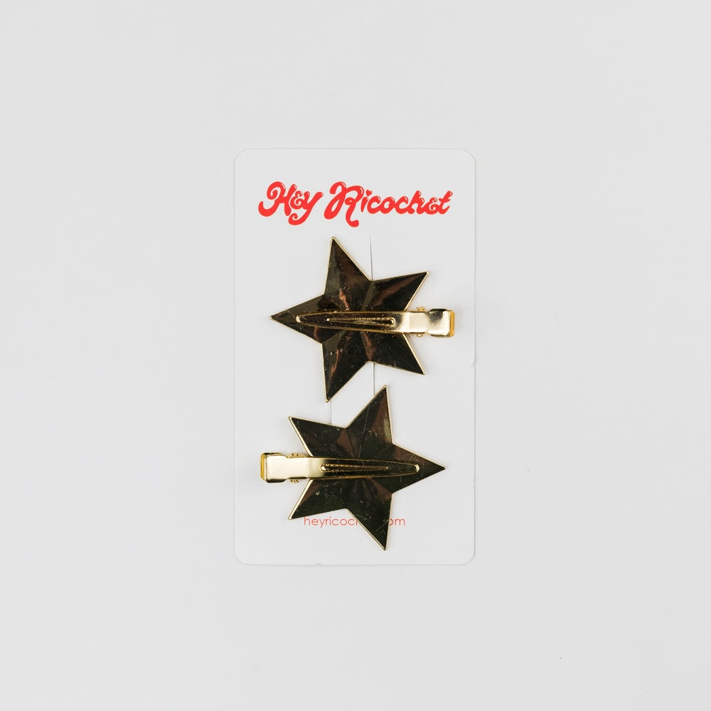 Star-shaped hair clips on a white card with 'Hey Ricochet' branding.