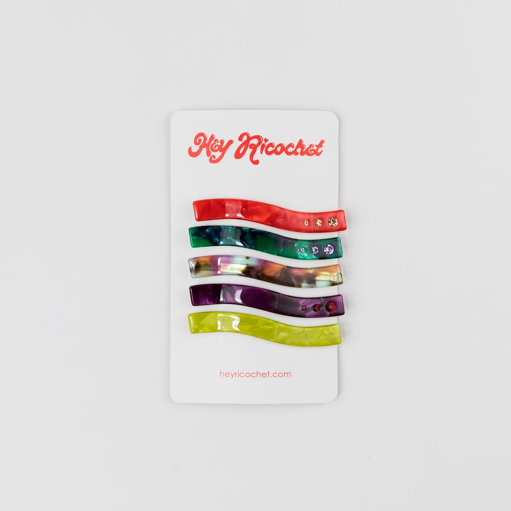 Set of colorful hair clips on a white card with 'Hey Ricochet' branding.