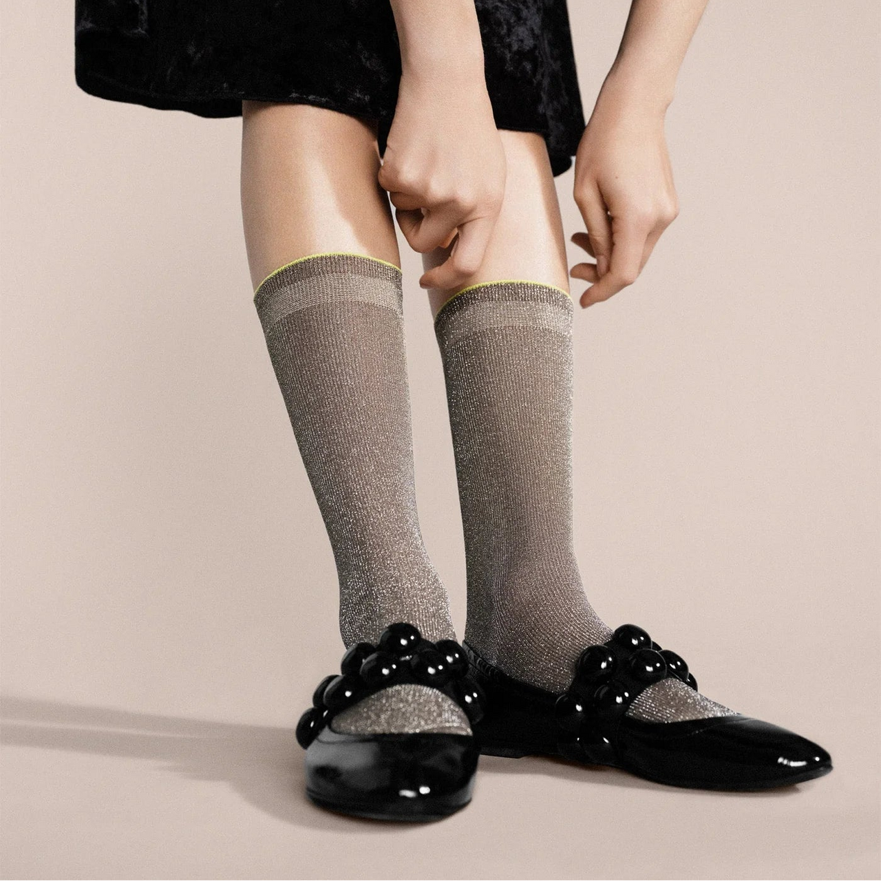 Brown sock with a label on a light gray background