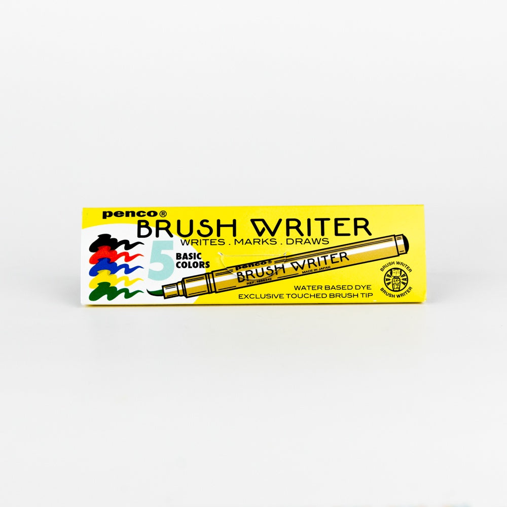 Box of Penco Brush Writer markers with a yellow background