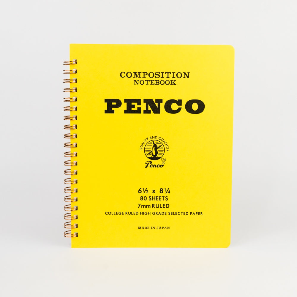 Yellow composition notebook with 'Penco' branding on a white background