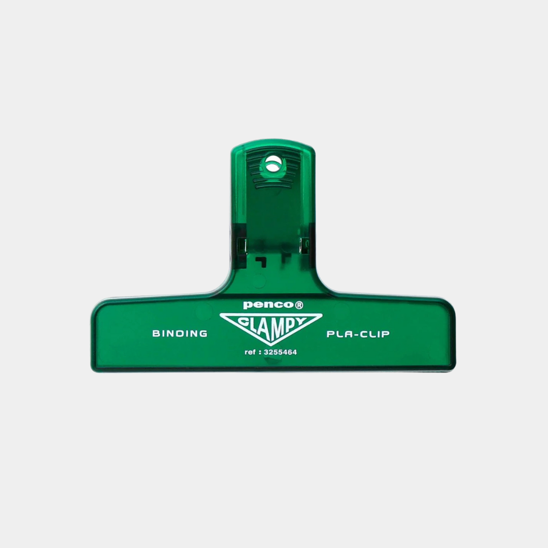 Green binding clip with 'Penco' branding on a light gray background