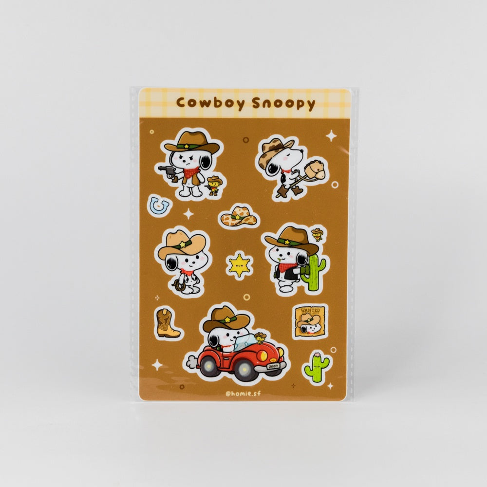 Sheet of 'Cowboy Snoopy' stickers with various poses on a brown background
