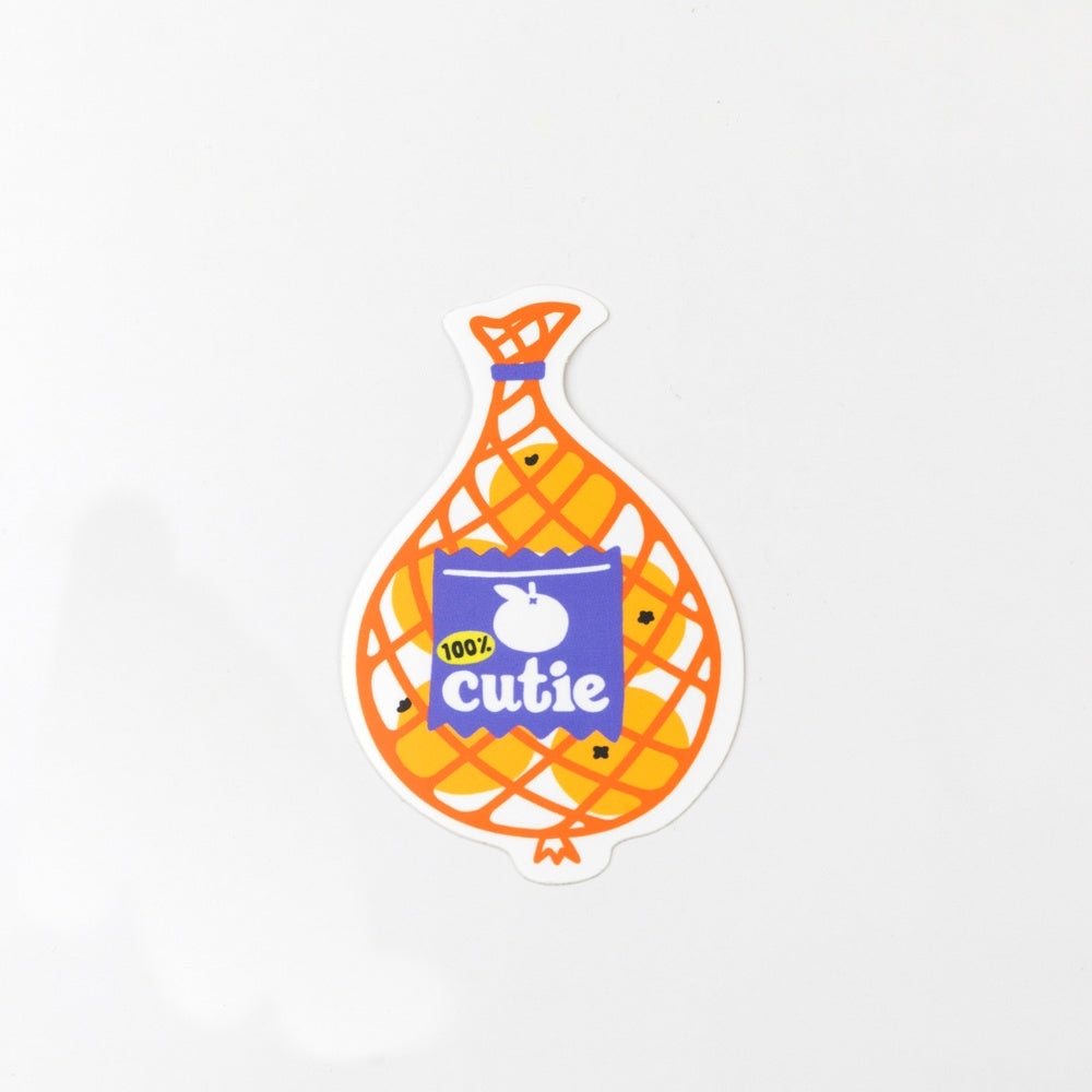 Sticker of a bag labeled '100% Cutie' on a white background