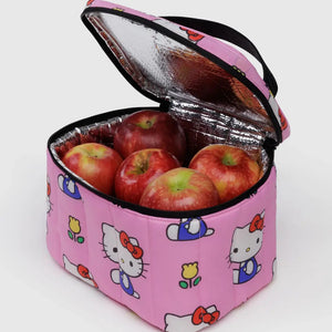 Pink insulated lunch bag with Hello Kitty designs containing red apples on a white background