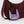 Brown handbag with a purple mini bag featuring a horse design on a white background