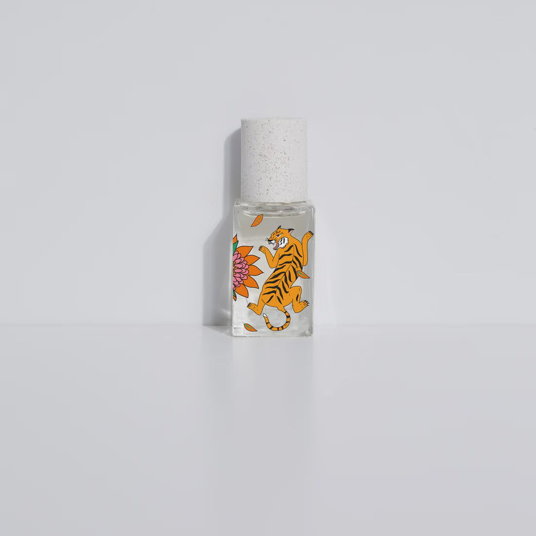 Small bottle with tiger design on a white background
