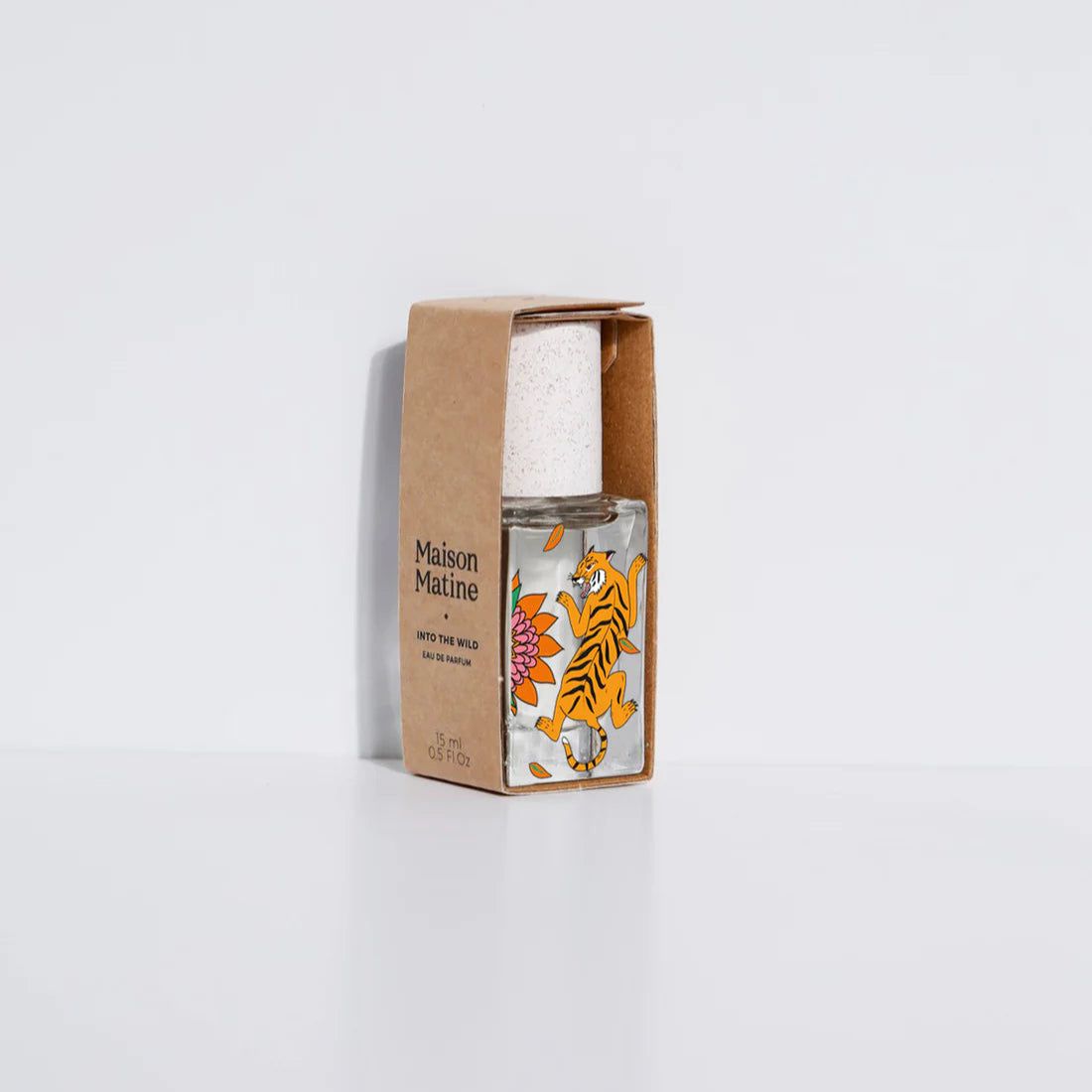 Small bottle with tiger design on a white background