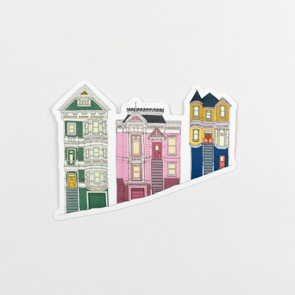 Three colorful house illustrations on a white background