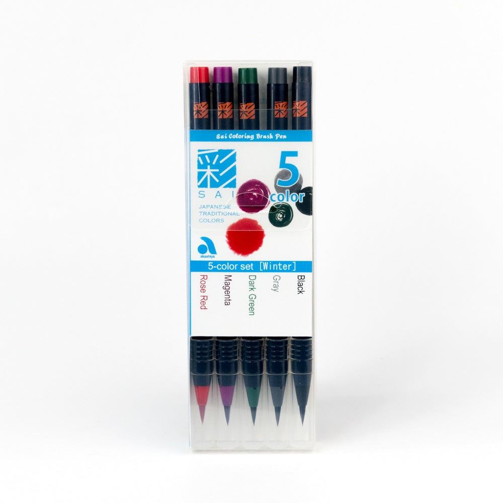 Set of five brush pens in a clear packaging with visible brand logo on a white background