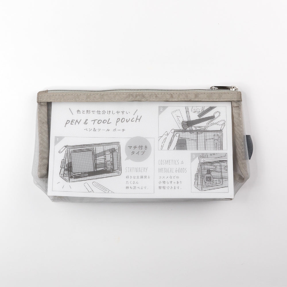 Clear pouch with mesh side showing wooden block and other items on a white background