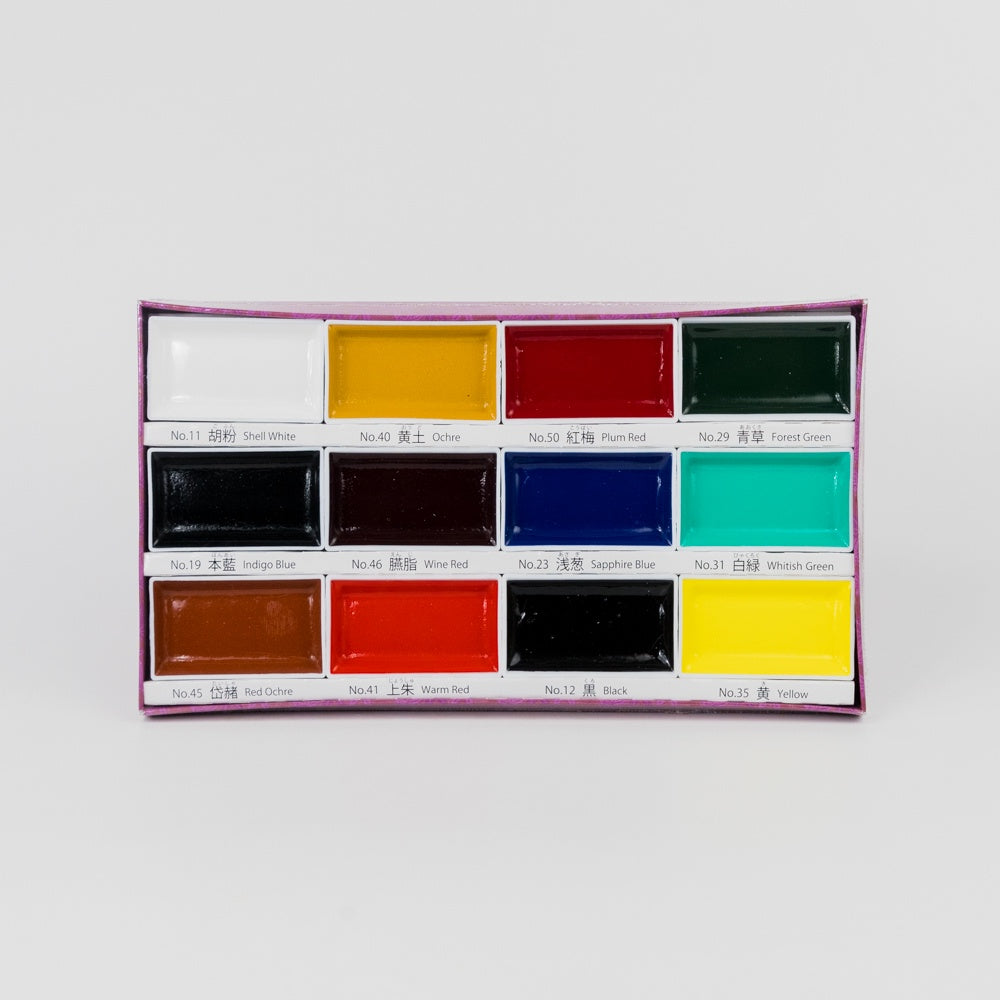 Set of watercolor paints in a rectangular palette on a white background