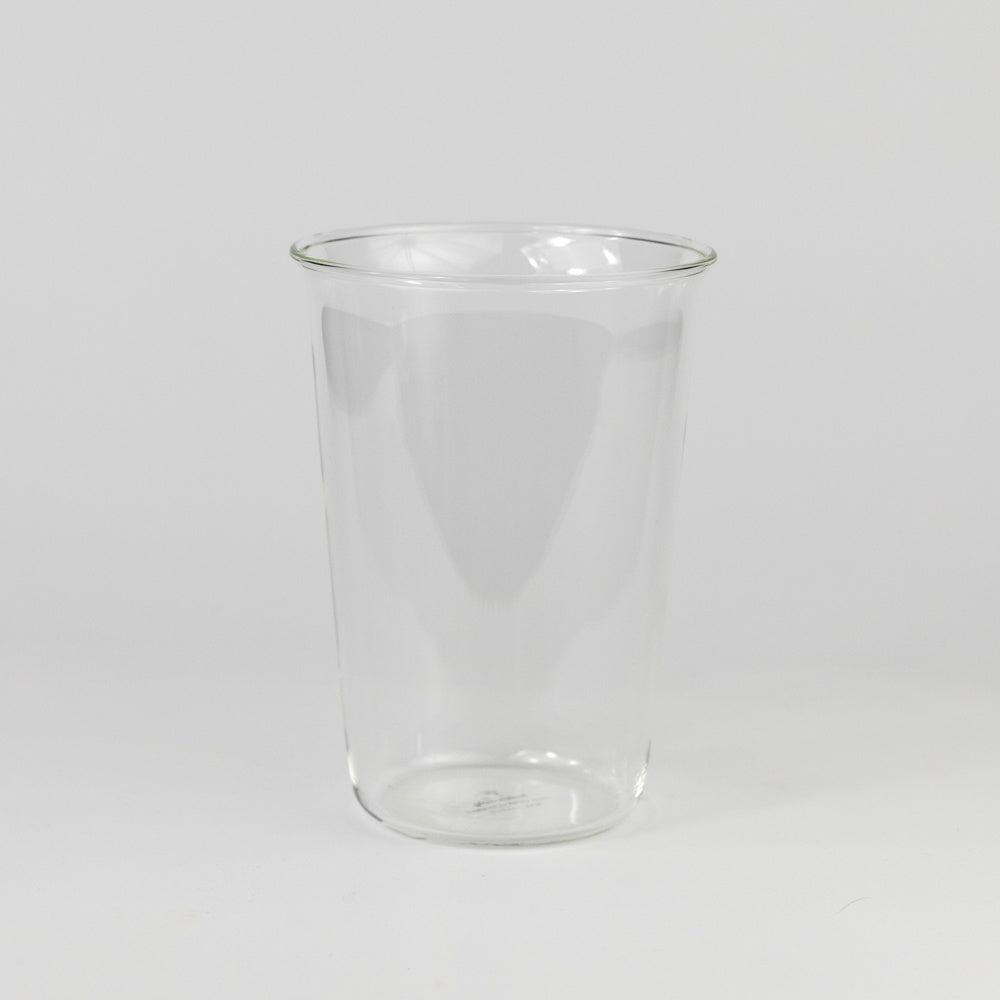 Clear glass tumbler on a white background
