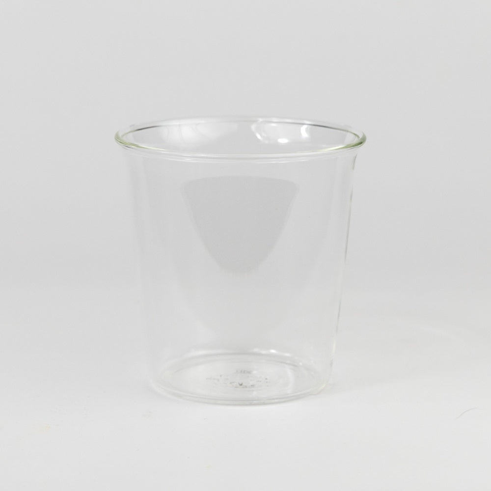 Clear glass tumbler on a white background