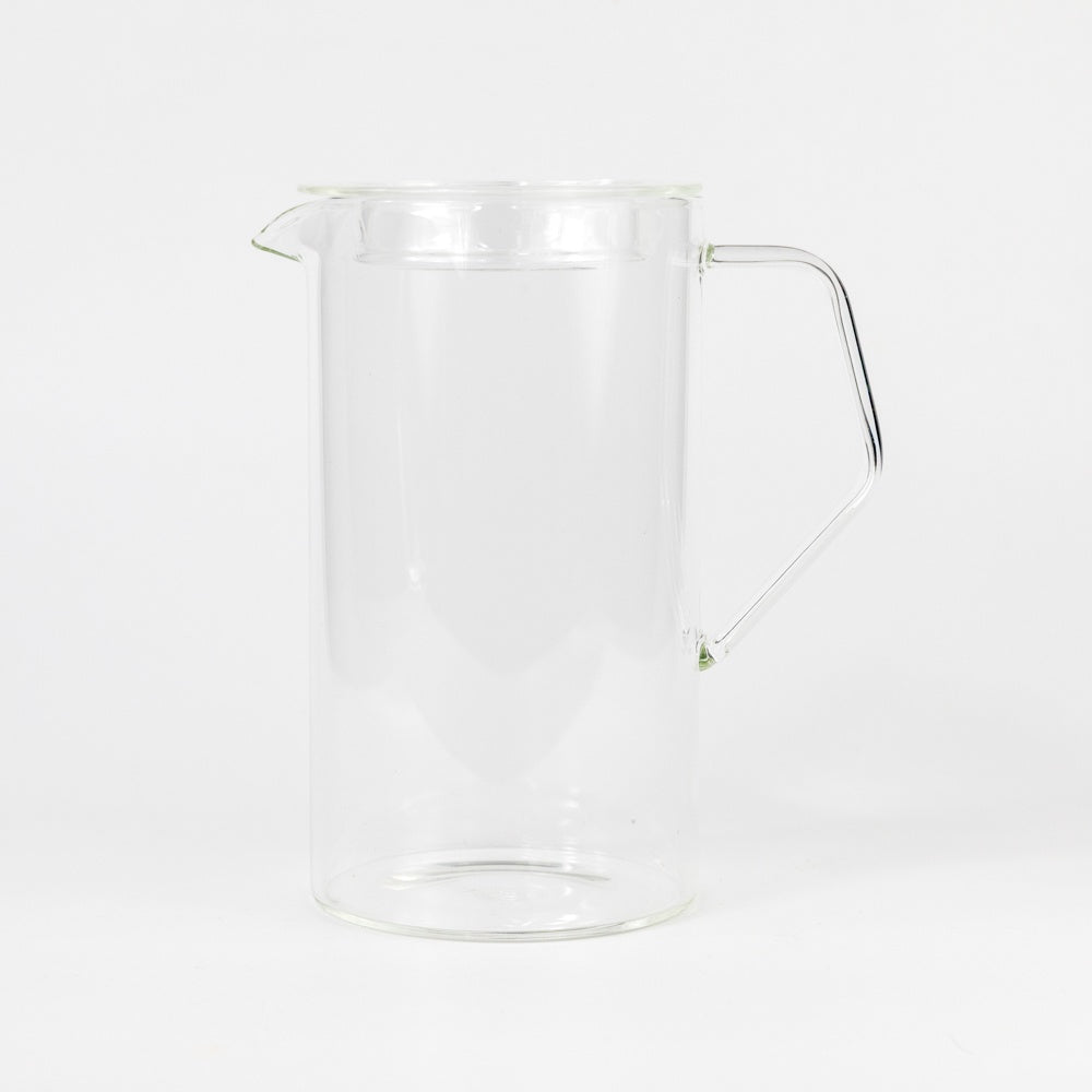 Clear glass pitcher on a white background