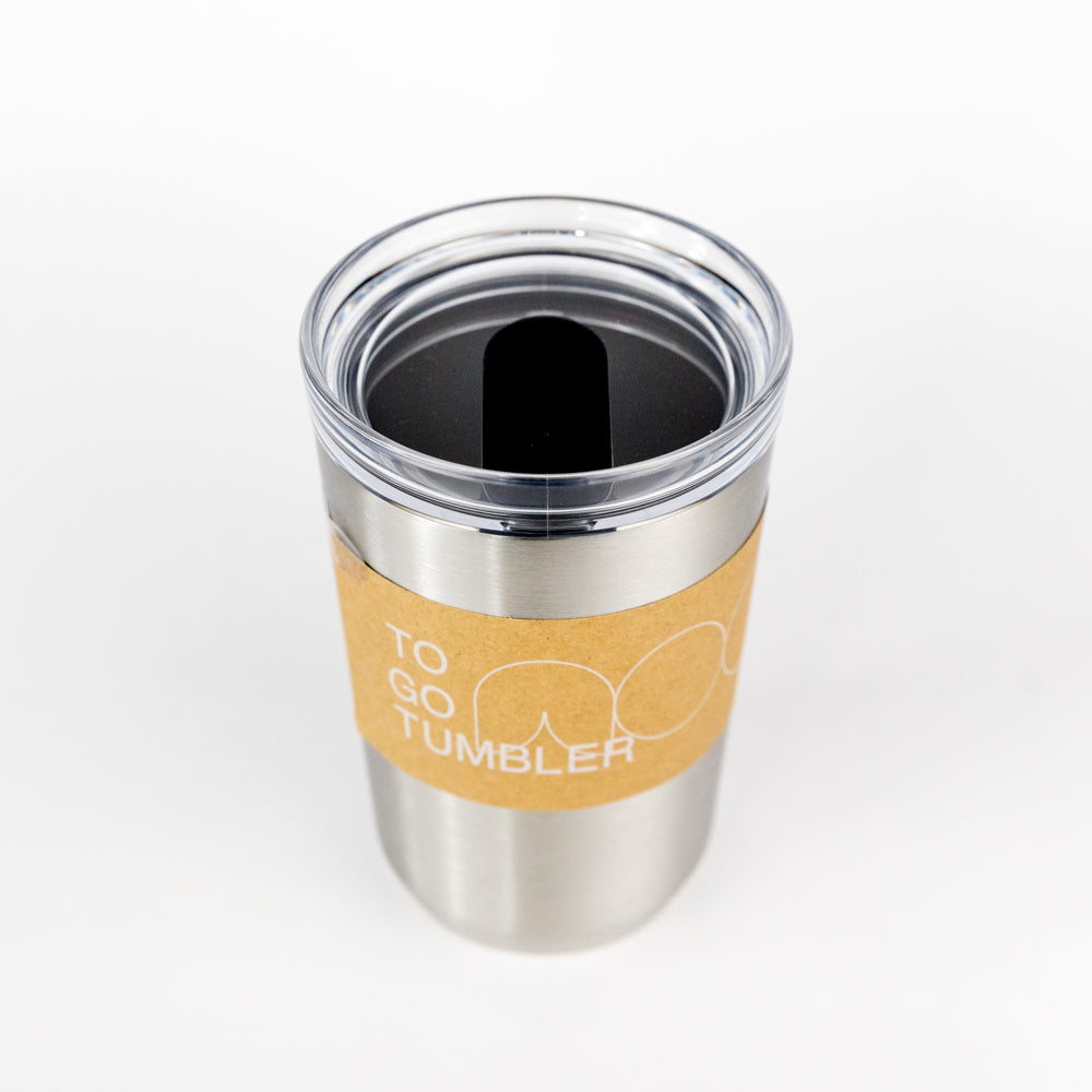 Stainless steel tumbler with a brown sleeve on a white background
