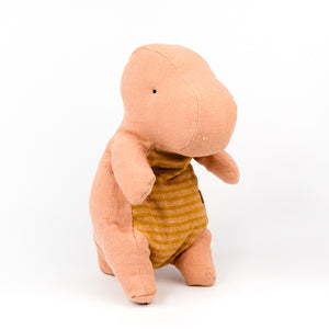 Plush pink dino toy on a white background
