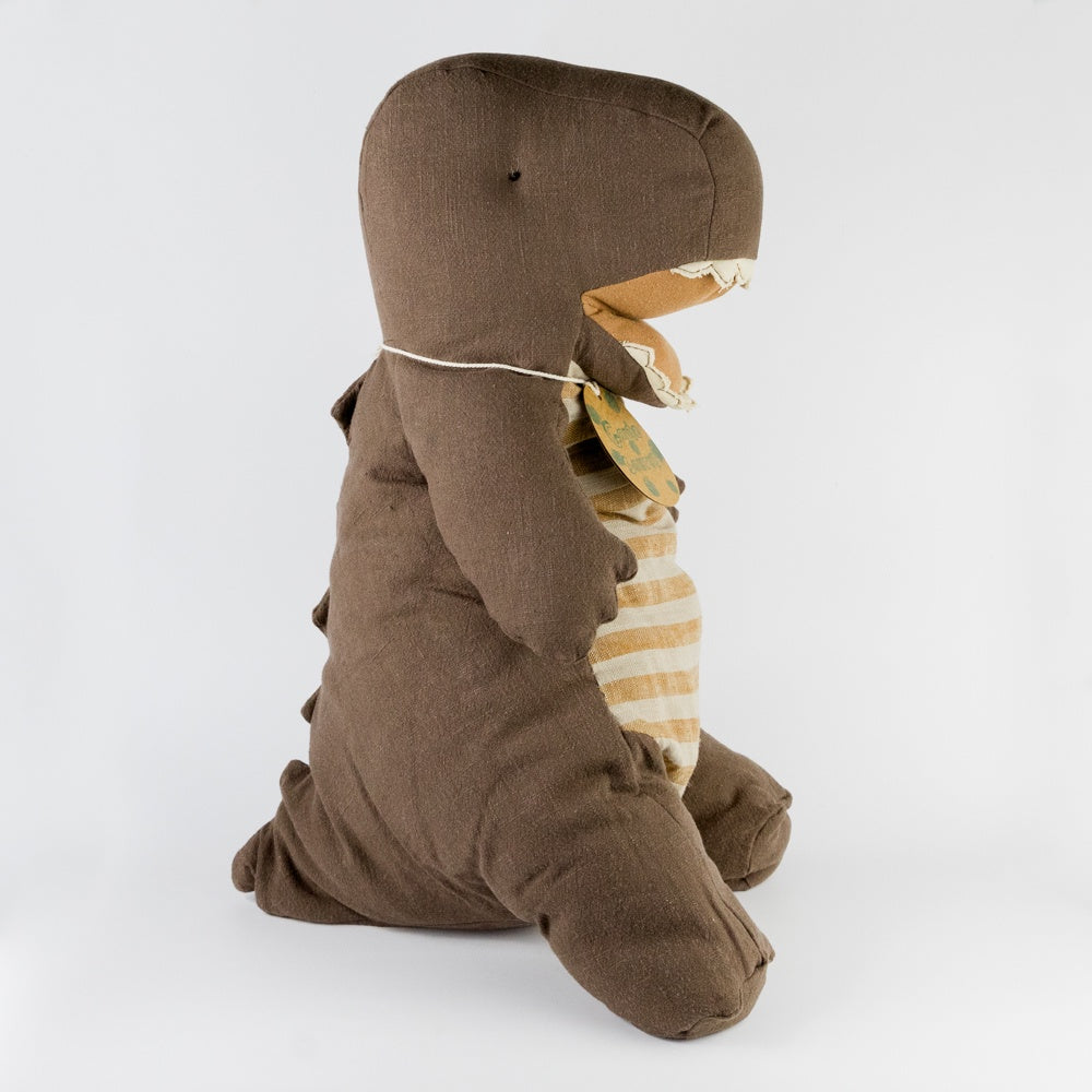 Brown dinosaur toy with a striped outfit on a white background