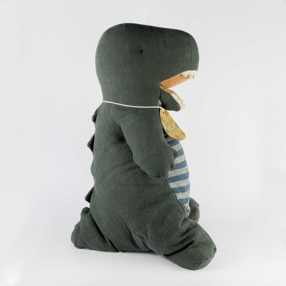 Stuffed dino toy with a striped body on a white background