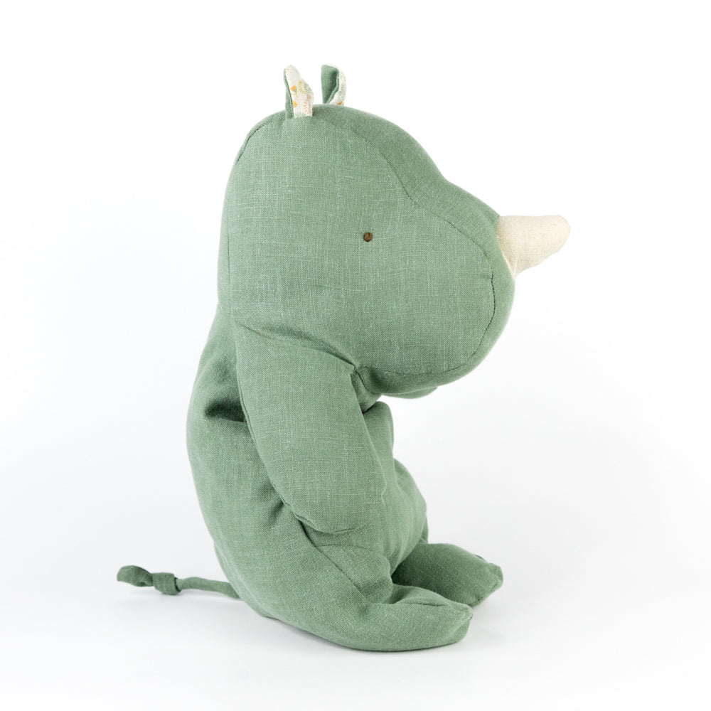 Green plush toy on a white background