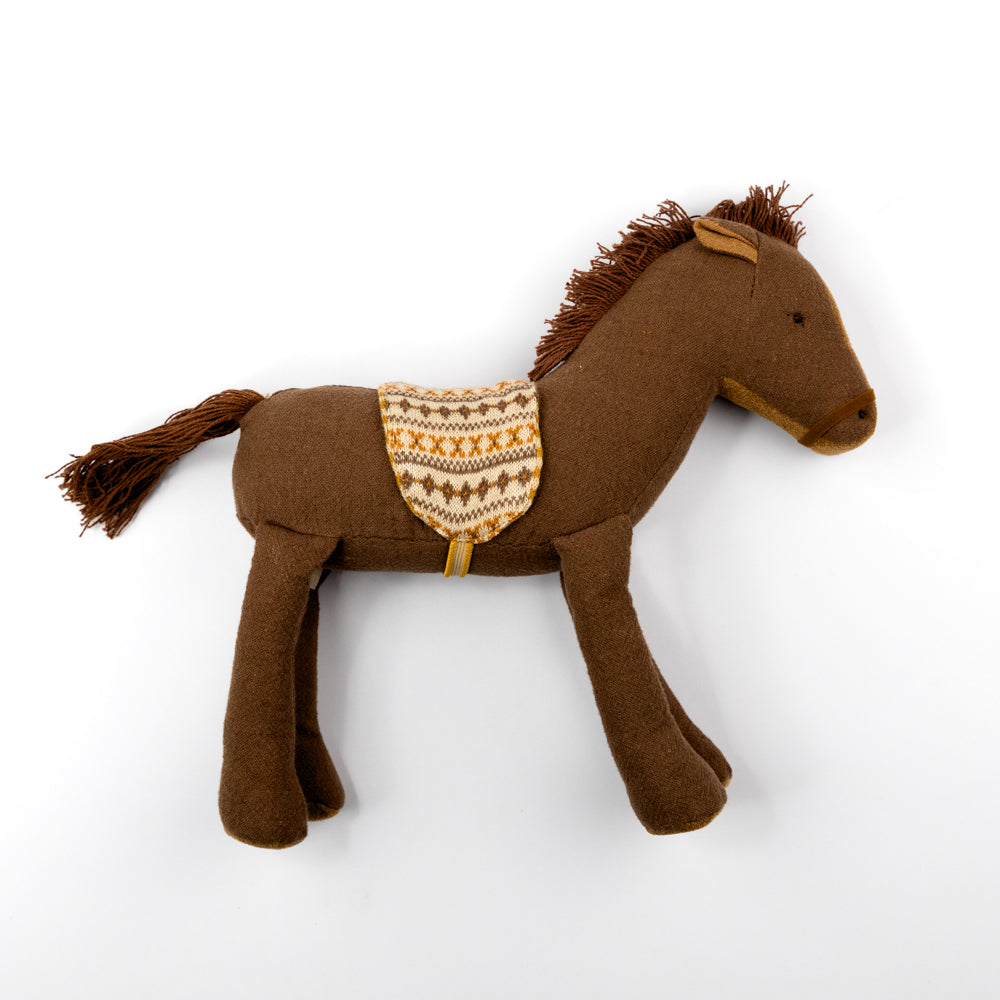 Brown plush horse toy with a saddle blanket on a white background