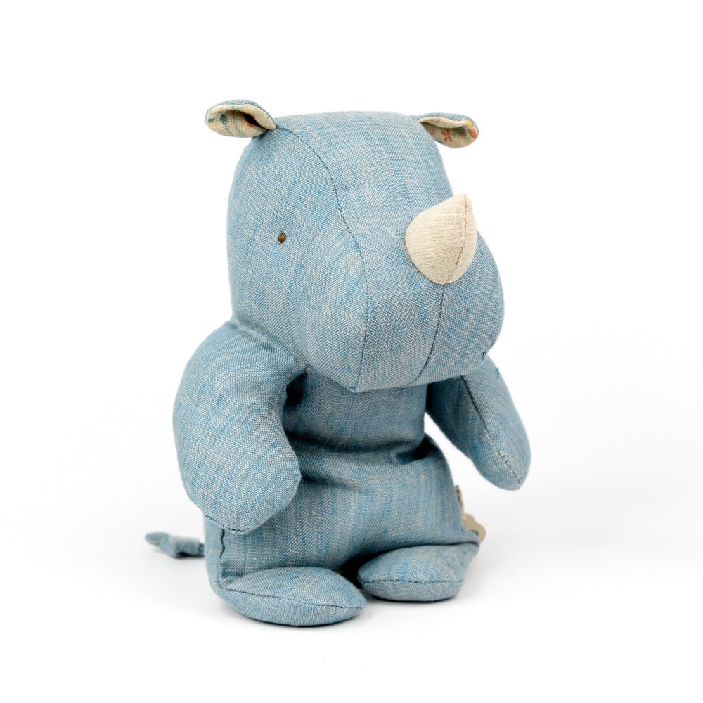 Blue plush toy rhino on a white background