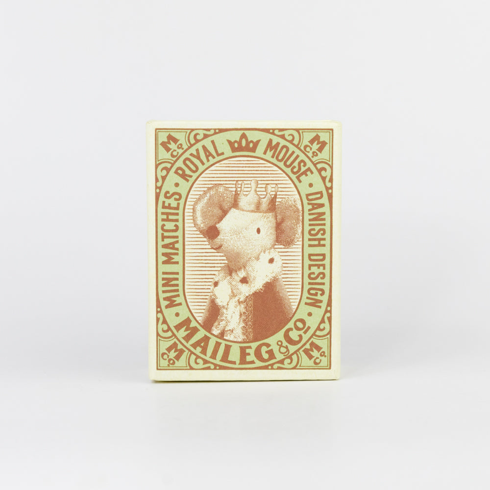 Matchbox with a design of a mouse wearing a crown and floral collar on a light green background.